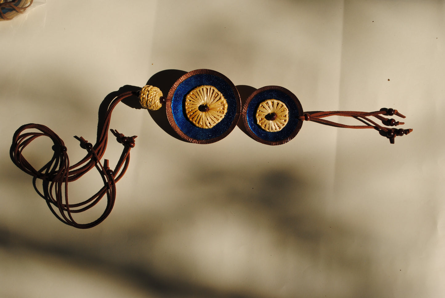 Truna natural fibre golden grass and copper enamel handcrafted jewelry from Odisha, Vaati blue enamel pendant