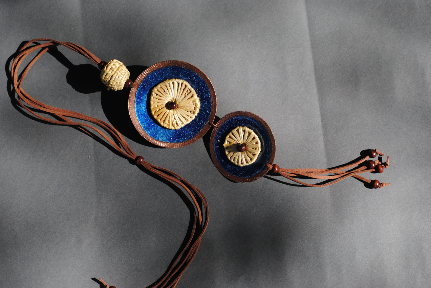 Truna natural fibre golden grass and copper enamel handcrafted jewelry from Odisha, Vaati blue enamel pendant