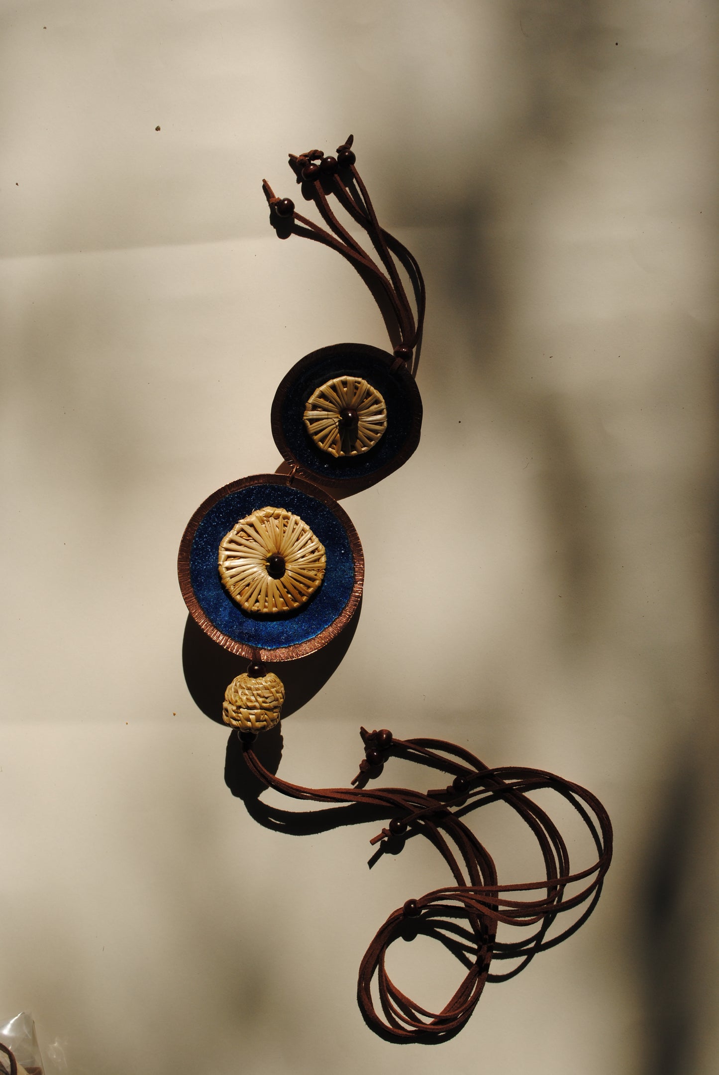 Truna natural fibre golden grass and copper enamel handcrafted jewelry from Odisha, Vaati blue enamel pendant