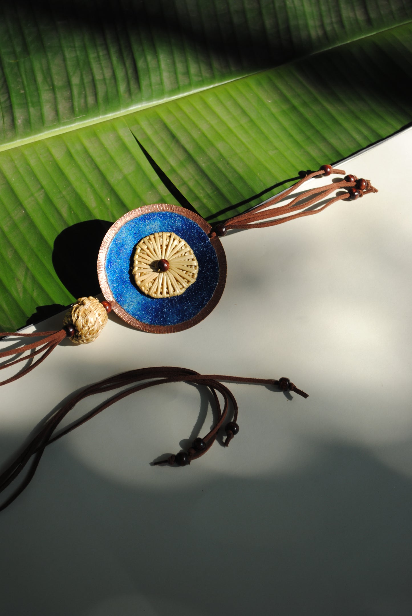 Truna natural fibre golden grass and copper enamel handcrafted jewelry from Odisha, Vaati blue pendant