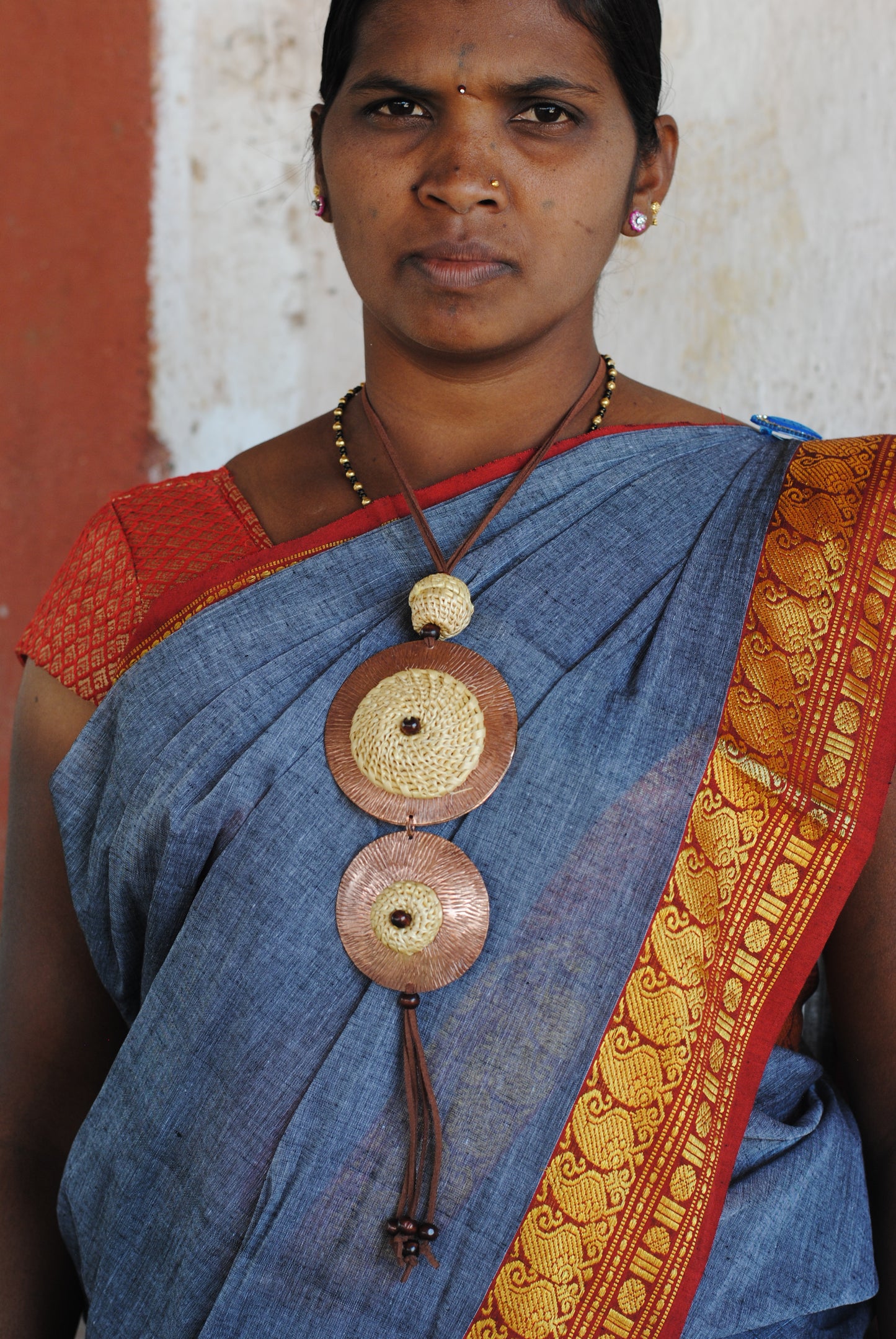 Truna natural fibre golden grass and copper enamel handcrafted jewelry from Odisha, Vaati green enamel pendant