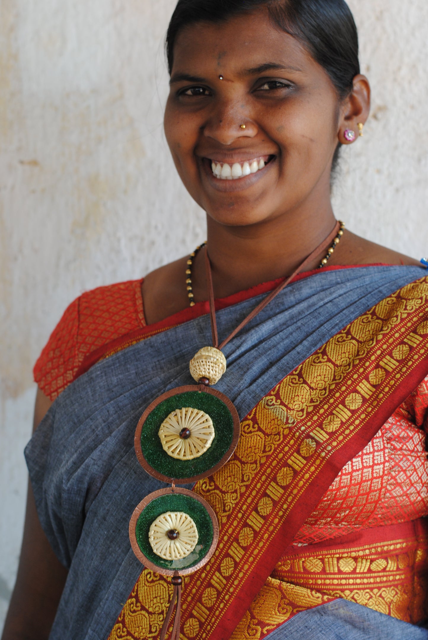 Truna natural fibre golden grass and copper enamel handcrafted jewelry from Odisha, Vaati green enamel pendant