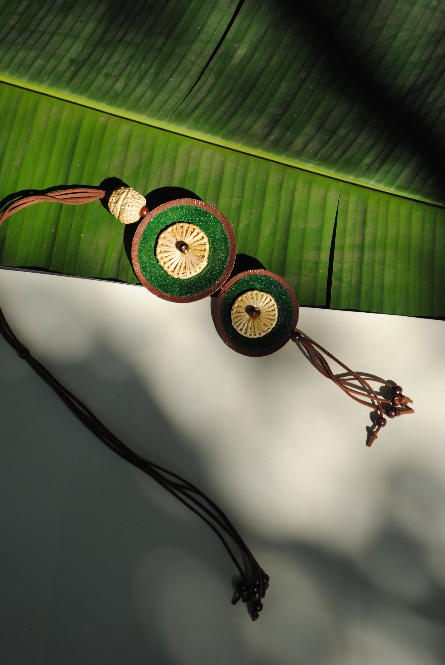 Truna natural fibre golden grass and copper enamel handcrafted jewelry from Odisha, Vaati green enamel pendant