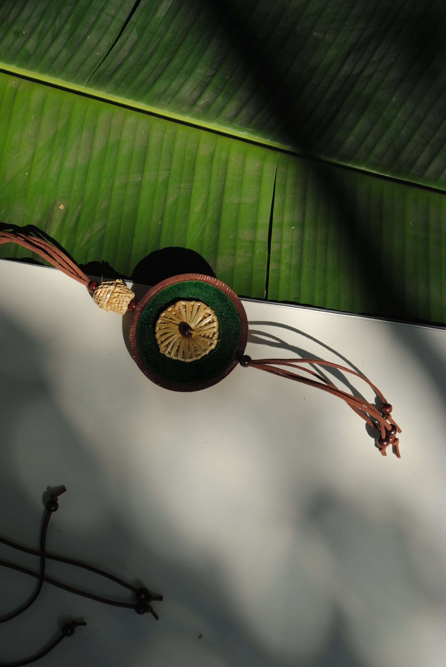 Truna natural fibre golden grass and copper enamel handcrafted jewelry from Odisha, Vaati green pendant