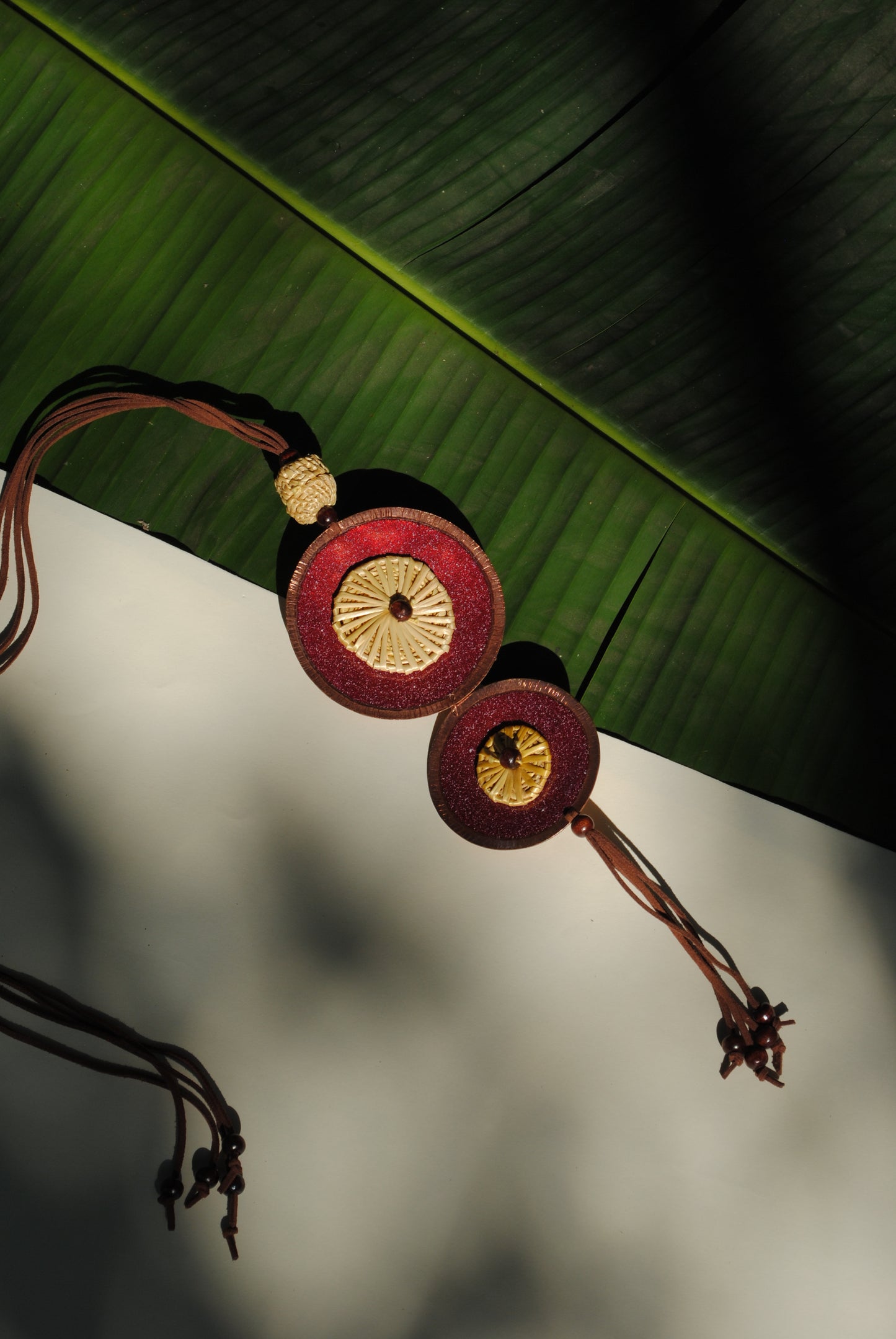 Truna natural fibre golden grass and copper enamel handcrafted jewelry from Odisha, Vaati red enamel pendant