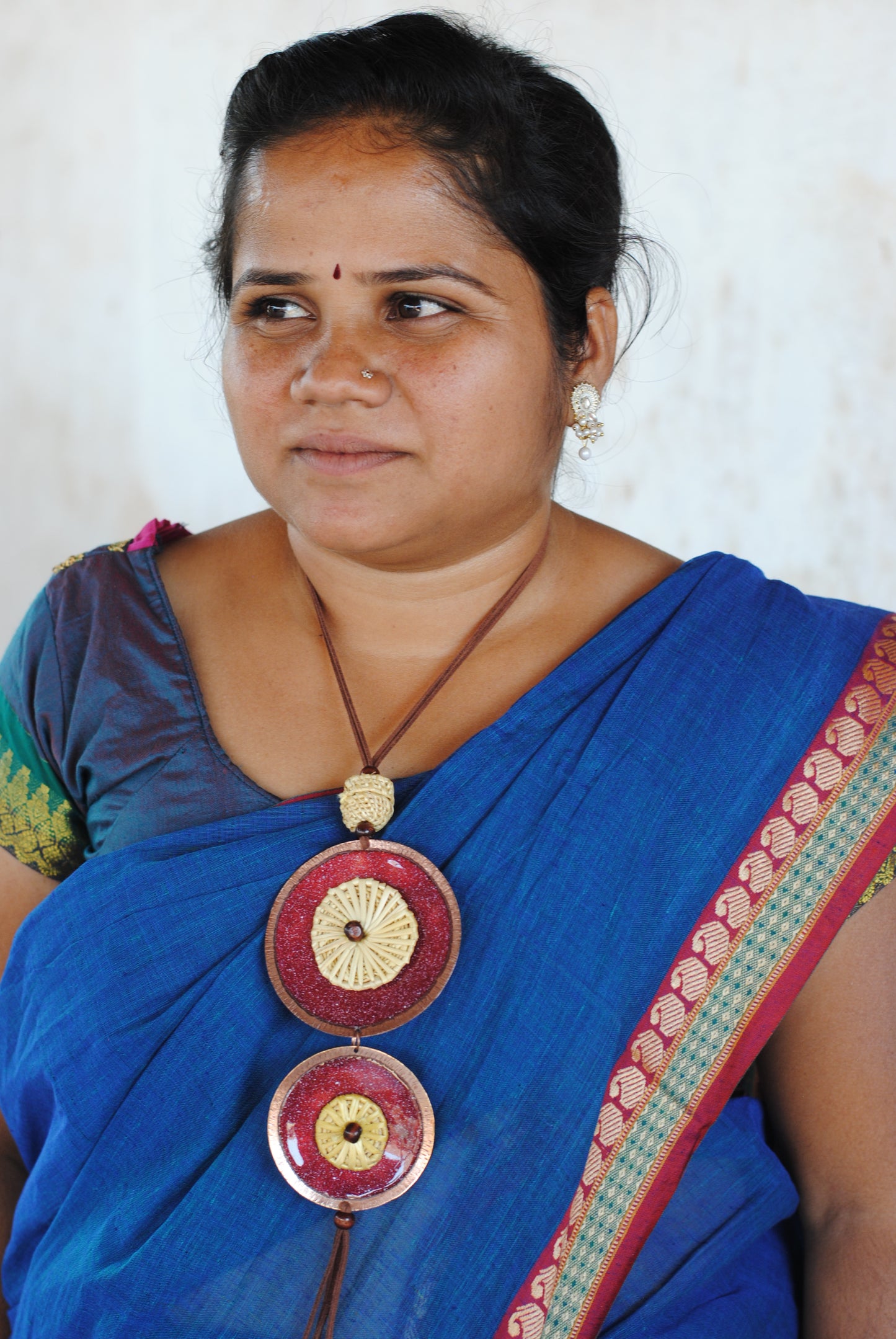 Truna natural fibre golden grass and copper enamel handcrafted jewelry from Odisha, Vaati red enamel pendant