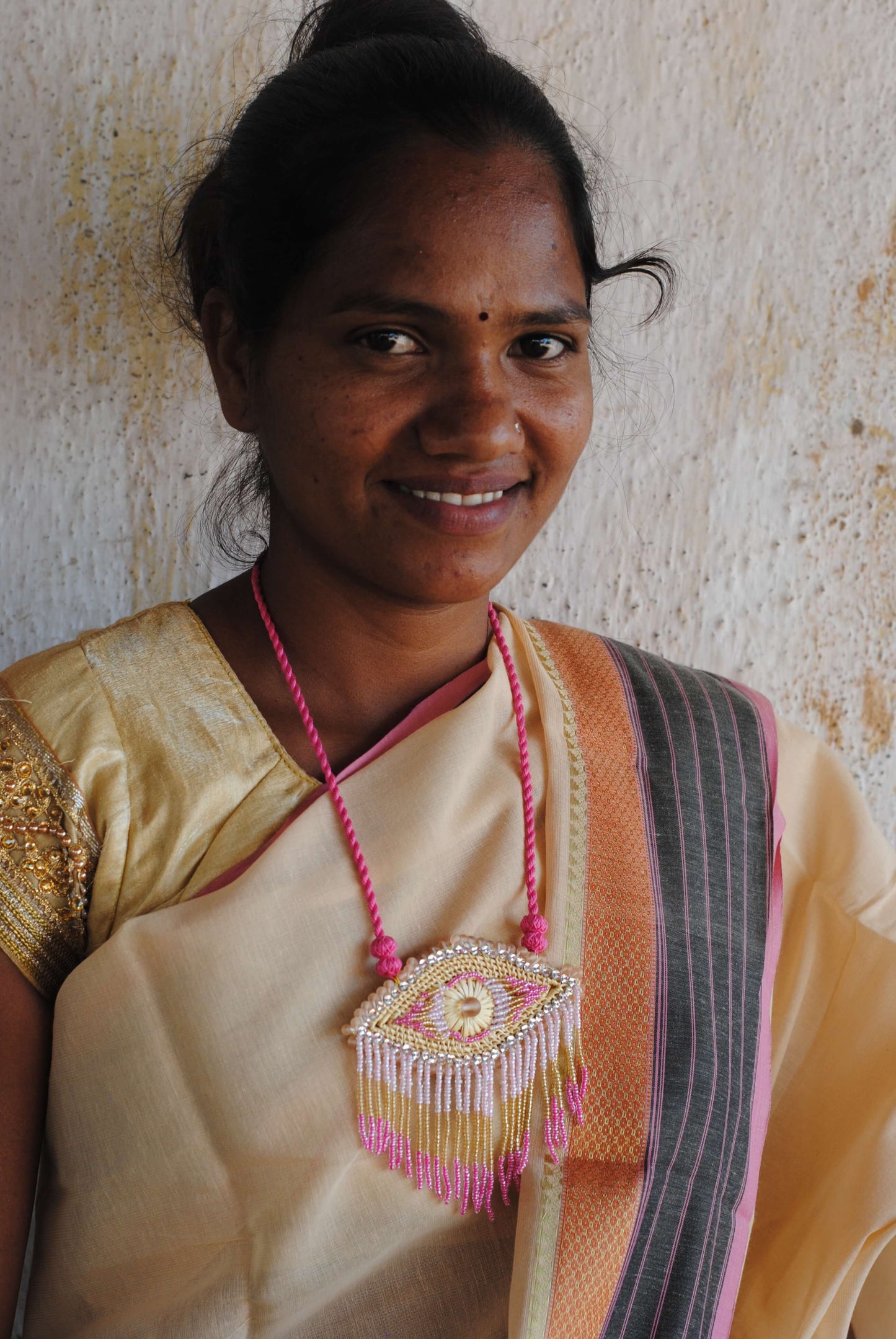 Truna natural fibre golden grass and zardosi handcrafted jewelry from Odisha, nazar pink pendant