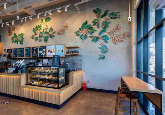 Handcrafted wall mural in Gond artwork in Starbucks cafe Bhopal India created by Ekibeki artisans