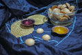 Two copper enameled lamps, coasters, mini cookies as part of gift box