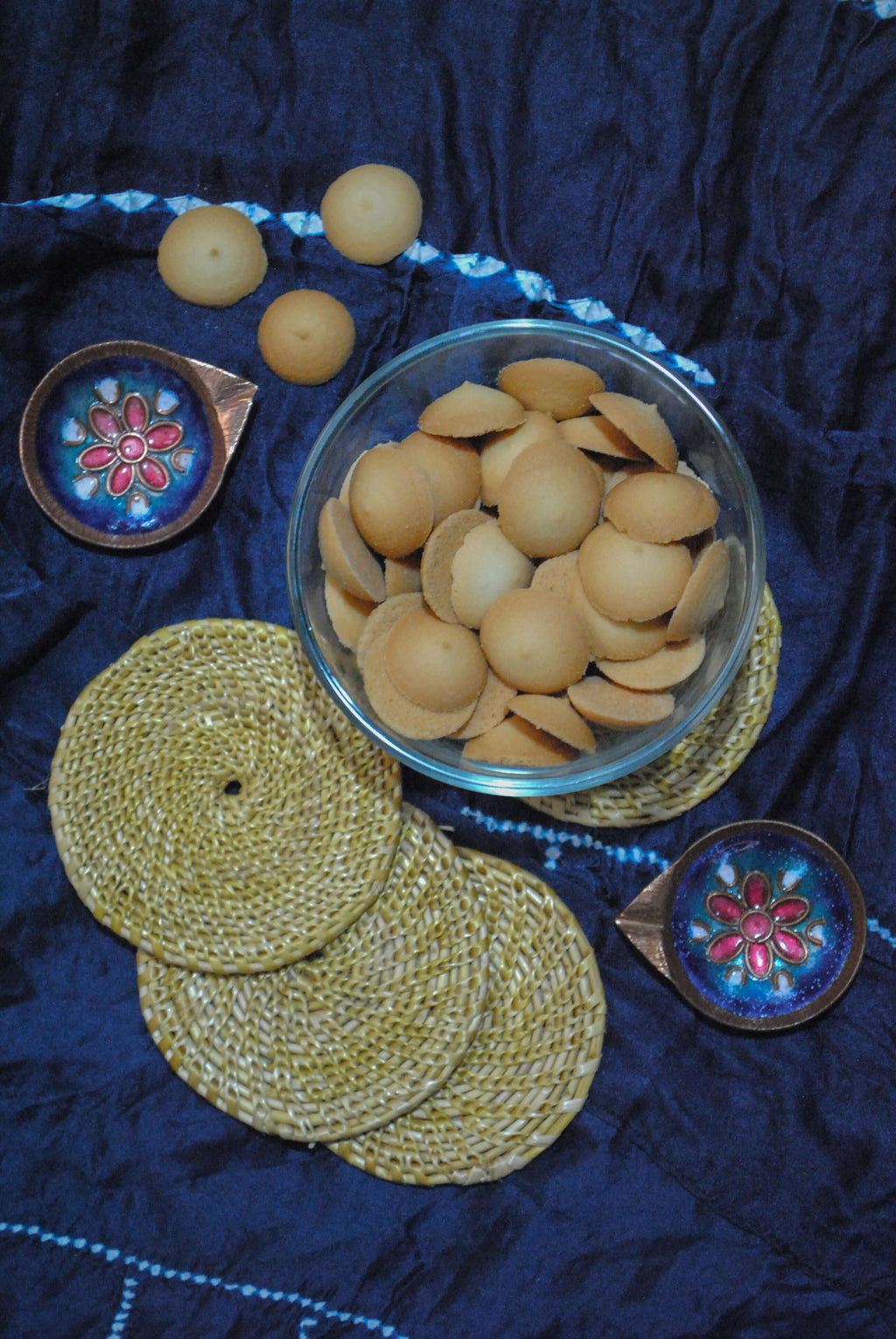 Gift box with copper enamel diya, handwoven coasters and mini cookies