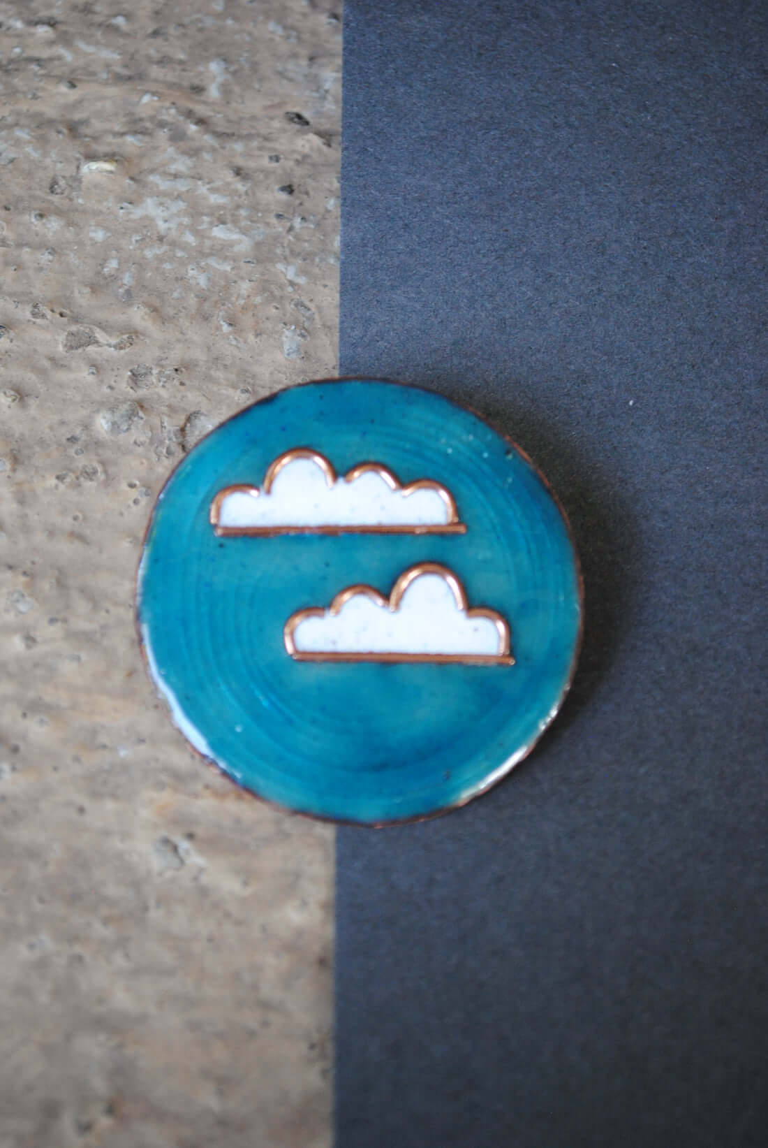Copper enamel jewelry, lapel pin handcrafted in Maharashtra, India. Baadal design