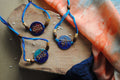 Handcrafted rakhi in beaten copper and enameled colours, one of its kind in devnagiri script