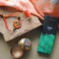 Handcrafted copper enameled rakhi with funky peacock morpankh motif, with a chocolate gift hamper for your sibling