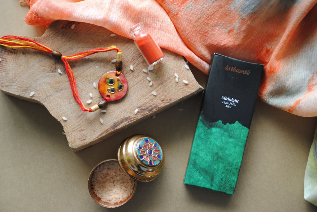 Handcrafted copper enameled rakhi with funky peacock morpankh motif, with a chocolate gift hamper for your sibling