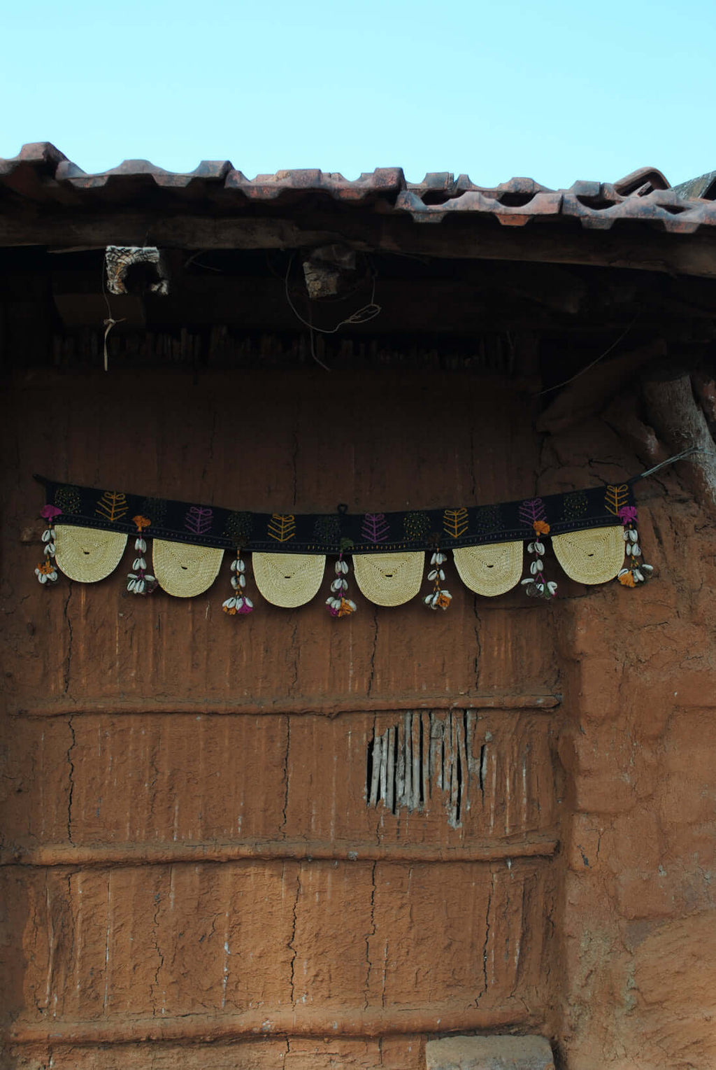 Handcrafted golden grass weavers create torans as new designs to keep the old art relevant in modern days