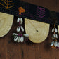 Handcrafted golden grass weavers create torans as new designs to keep the old art relevant in modern days