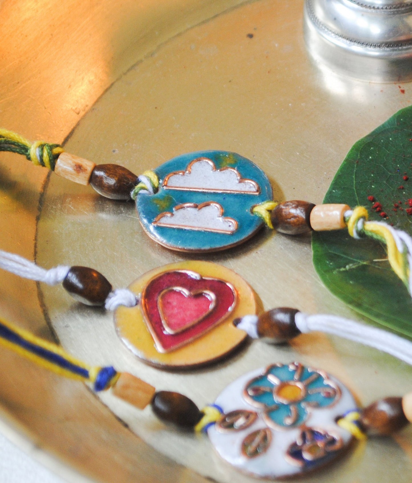 Handcrafted "Baadal" Copper Enamel Rakhi by EkiBeki