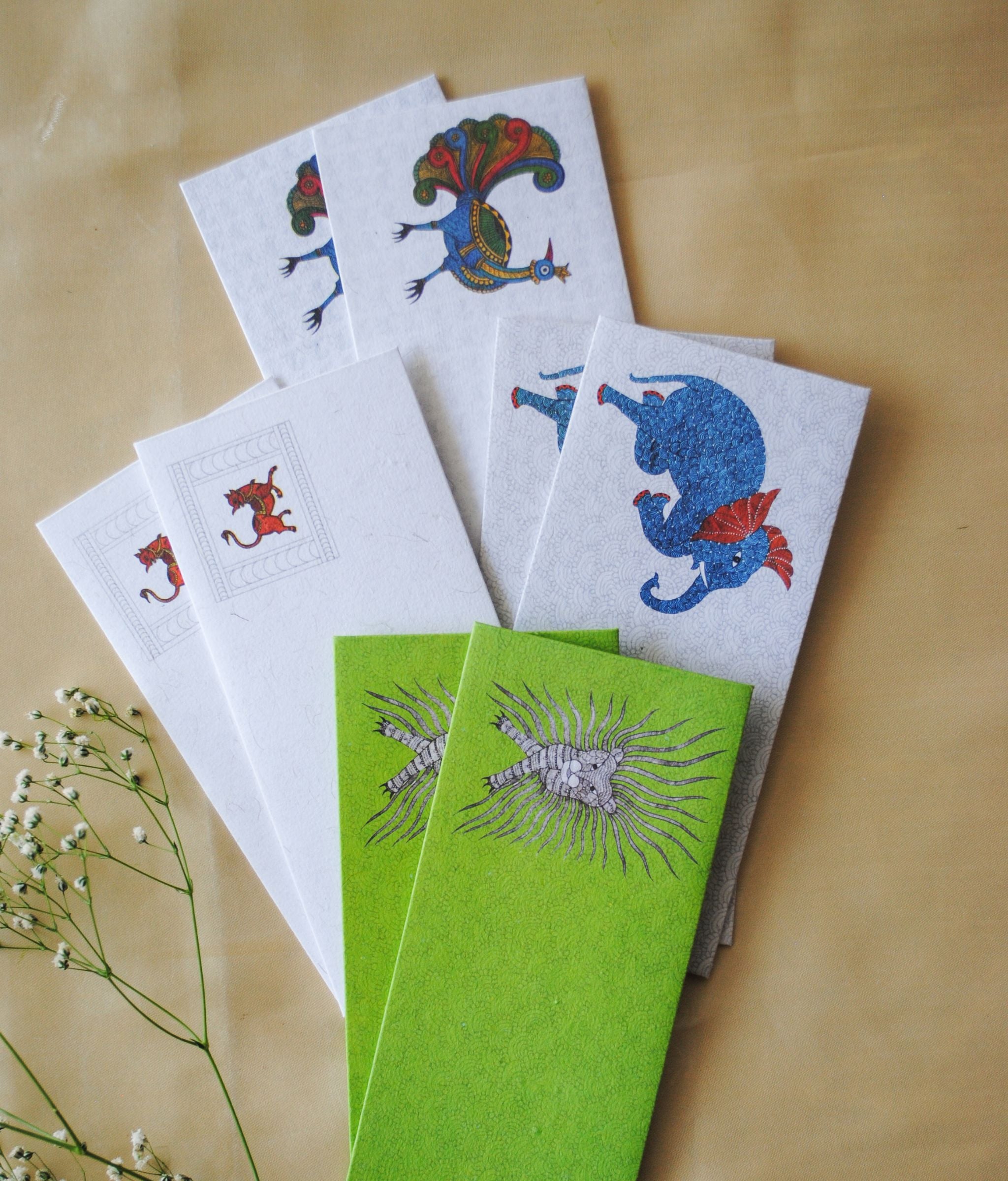 Artwork by native craftsmen of Chitrakathi, Gond, that are used as motifs to create stationery and gift envelopes