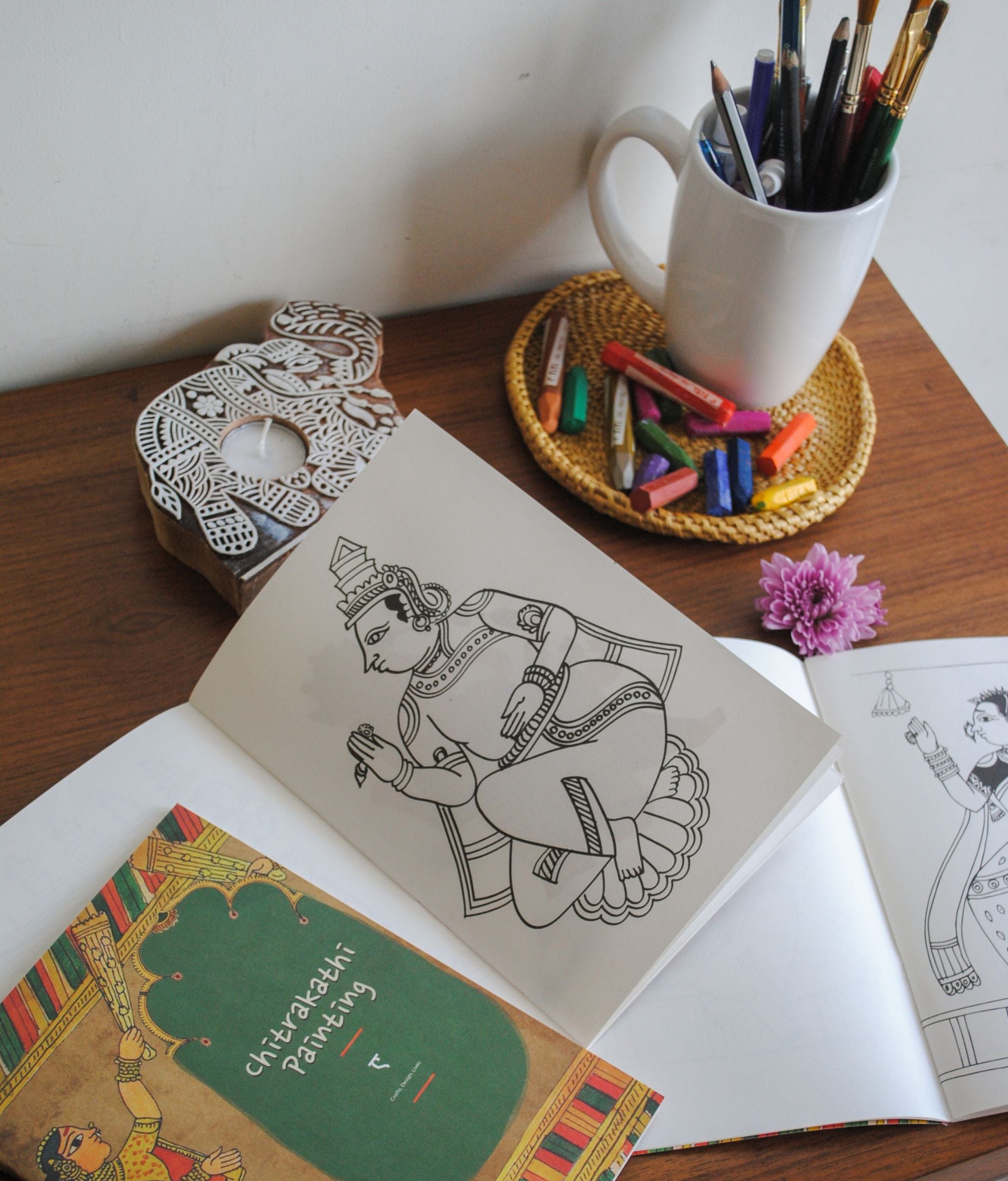 Artwork by native craftsmen of Chitrakathi, Gond, that are used as motifs to create stationery and colouring books