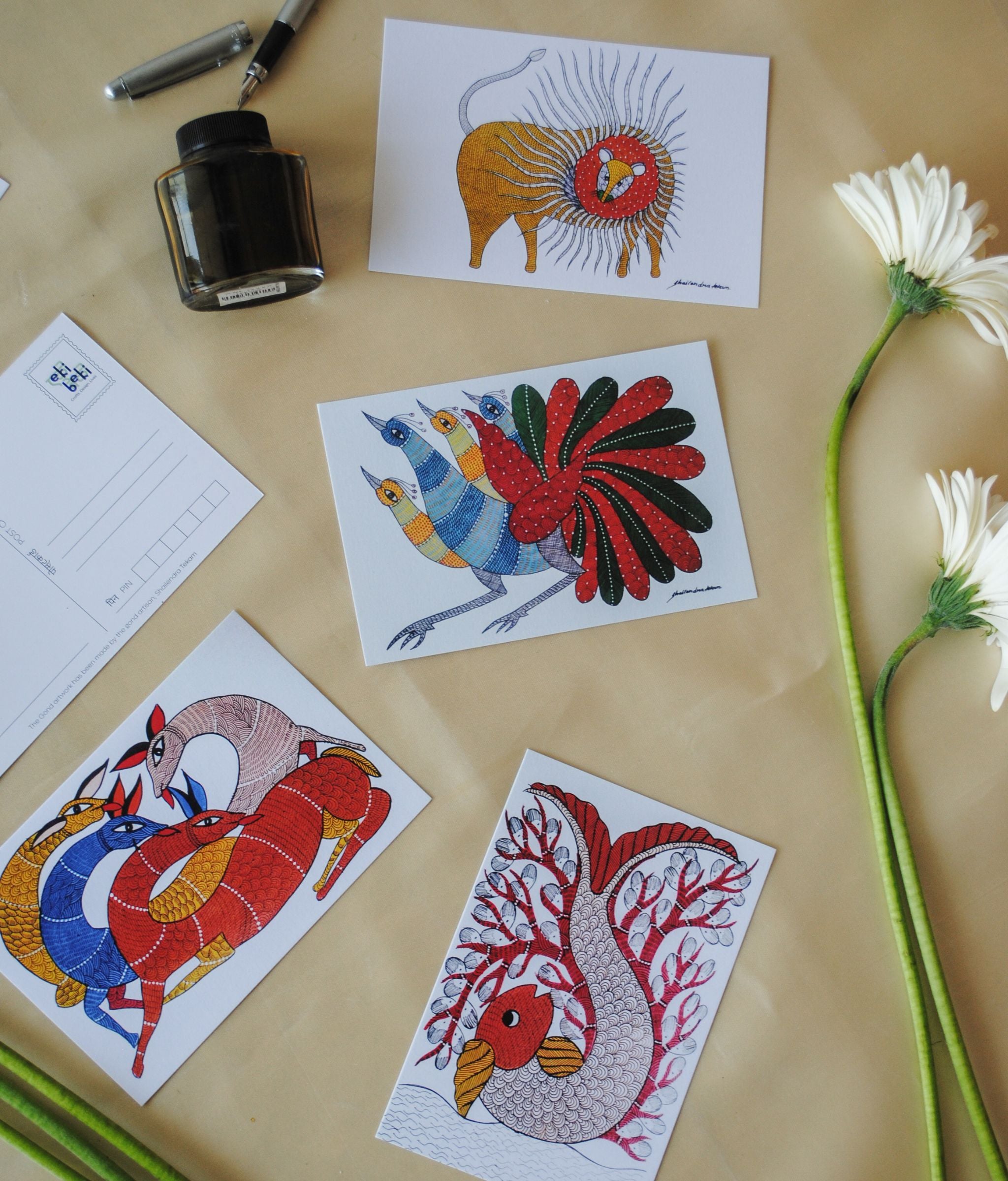 Artwork by native craftsmen of Chitrakathi, Gond, that are used as motifs to create stationery