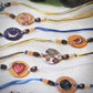 Handcrafted "Phool" Copper Enamel Rakhi by EkiBeki