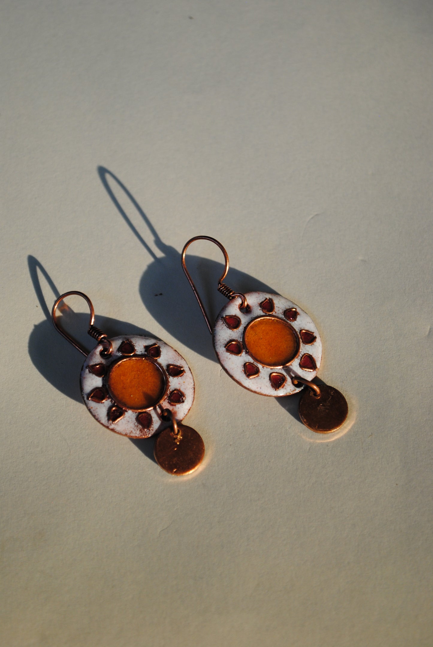 Copper enamel trinkets, funky earrings handcrafted in Maharashtra, India. Sun sooraj theme