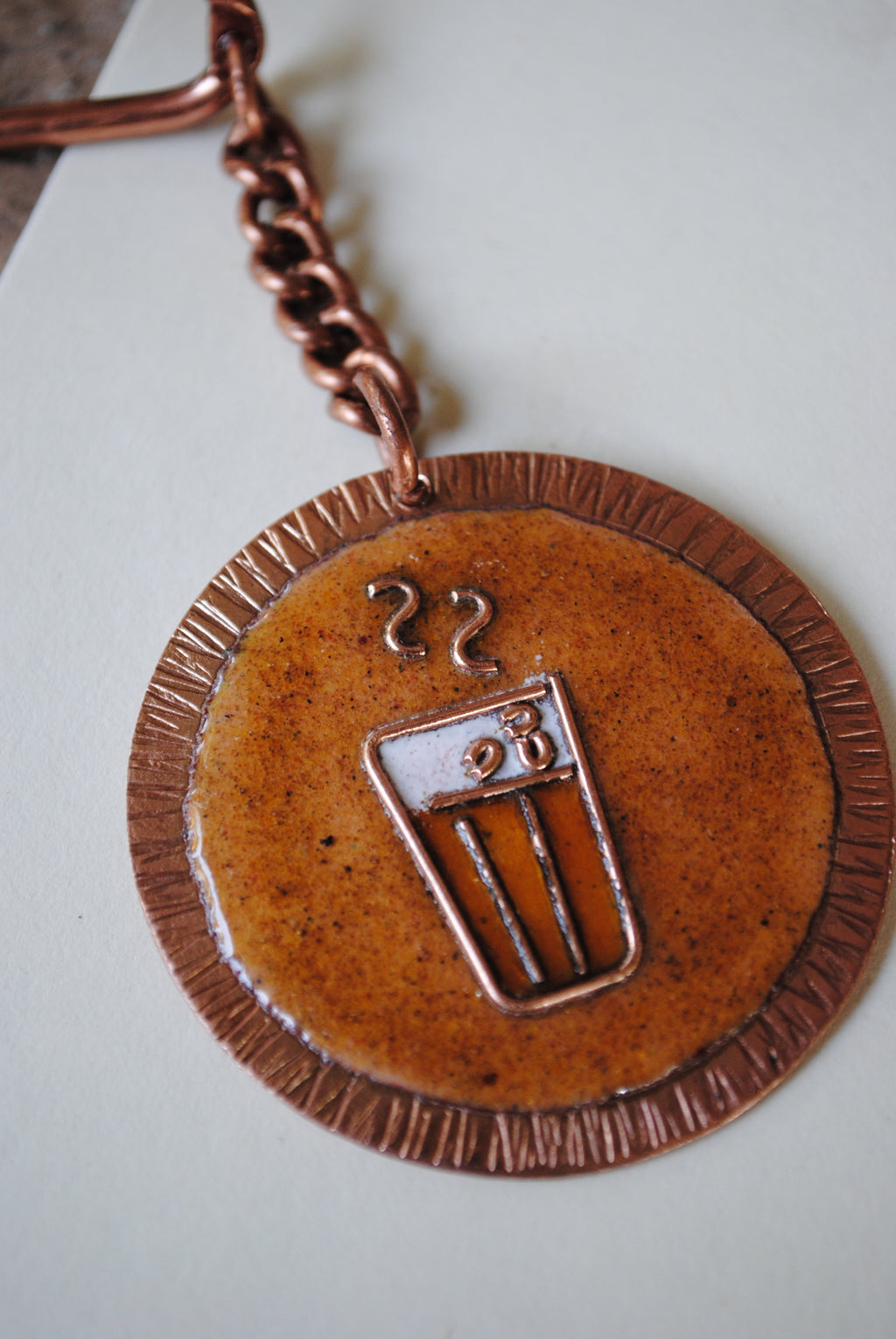 Copper enamel trinkets, funky keychains handcrafted in Maharashtra, India. Chai paani theme