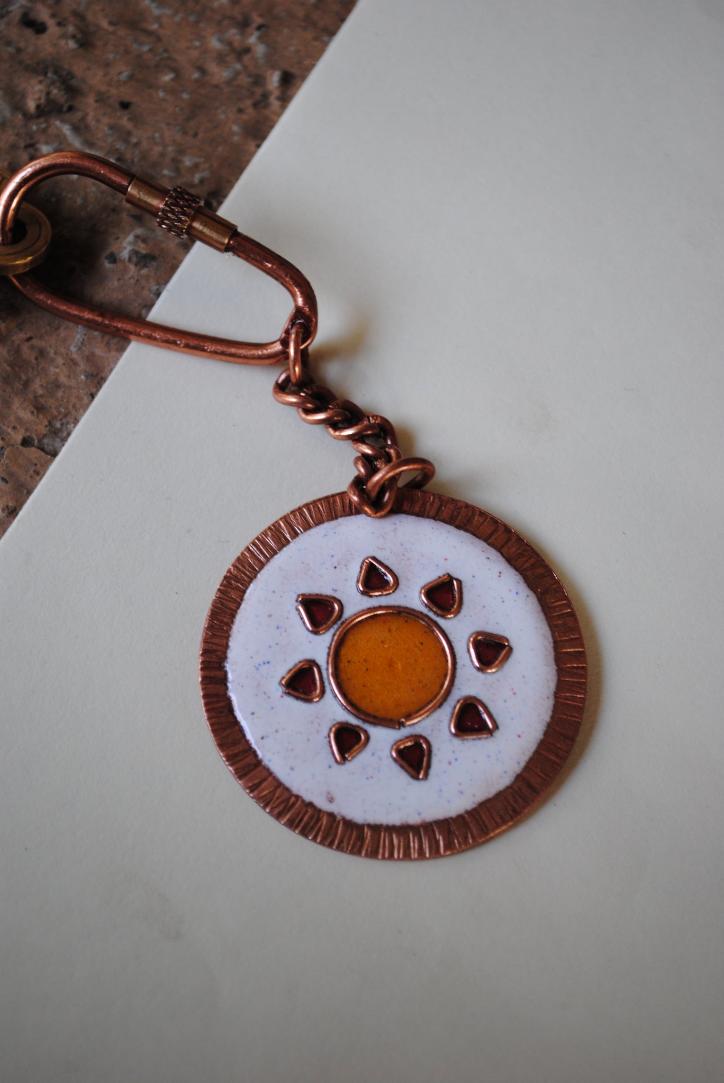 Copper enamel trinkets, funky keychains handcrafted in Maharashtra, India. Sooraj sun theme