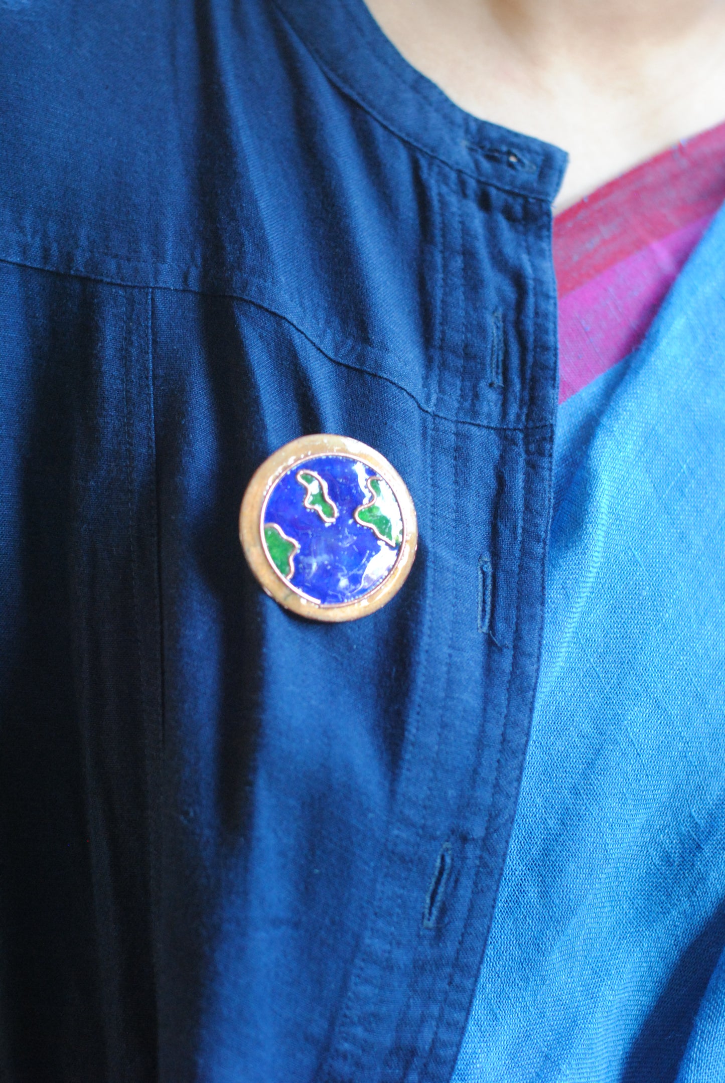 Copper enamel trinkets, funky lapel pins handcrafted in Maharashtra, India. World map theme