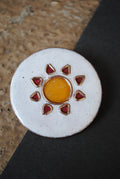 Copper enamel trinkets, funky lapel pins handcrafted in Maharashtra, India. Sun sooraj theme