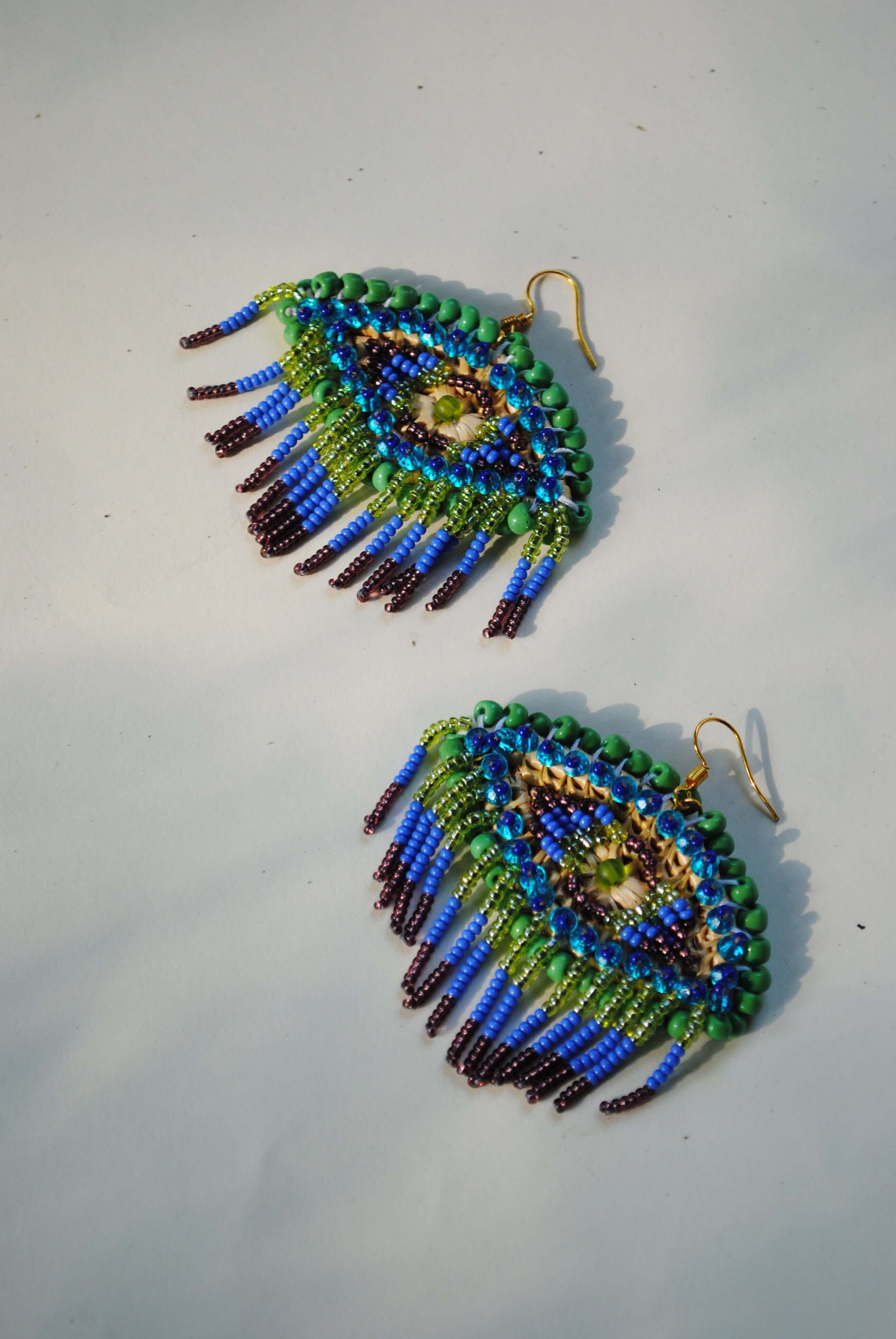 Truna natural fibre golden grass and zardosi handcrafted jewelry from Odisha, nazar peacock blue earrings set