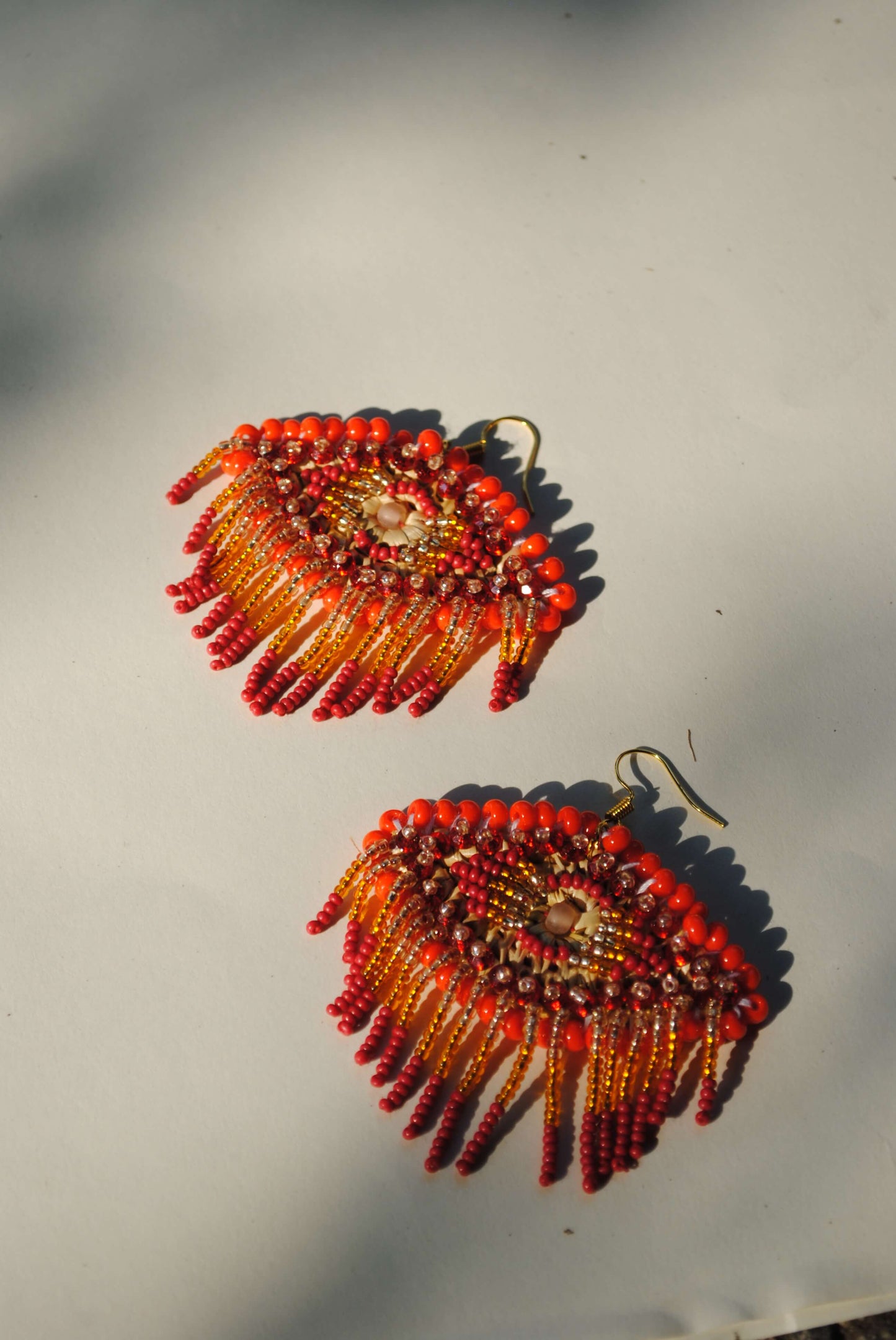 Truna natural fibre golden grass and zardosi handcrafted jewelry from Odisha, nazar red earrings