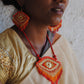 Truna natural fibre golden grass and zardosi handcrafted jewelry from Odisha, nazar red pendant and earrings set