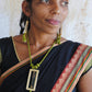 Truna natural fibre golden grass and copper enamel handcrafted jewelry from Odisha. Jharokha set of earrings and pendant