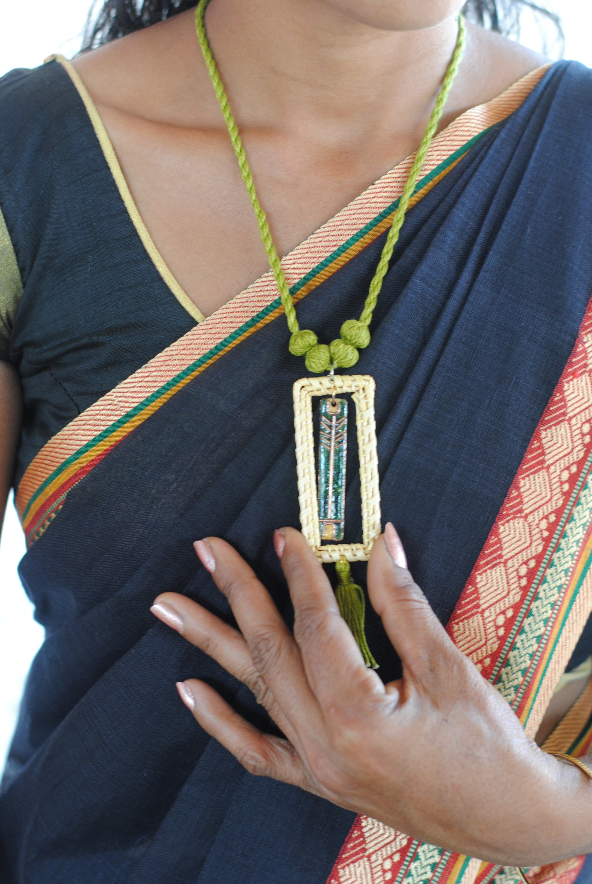 Truna natural fibre golden grass and copper enamel handcrafted jewelry from Odisha. Jharokha pendant