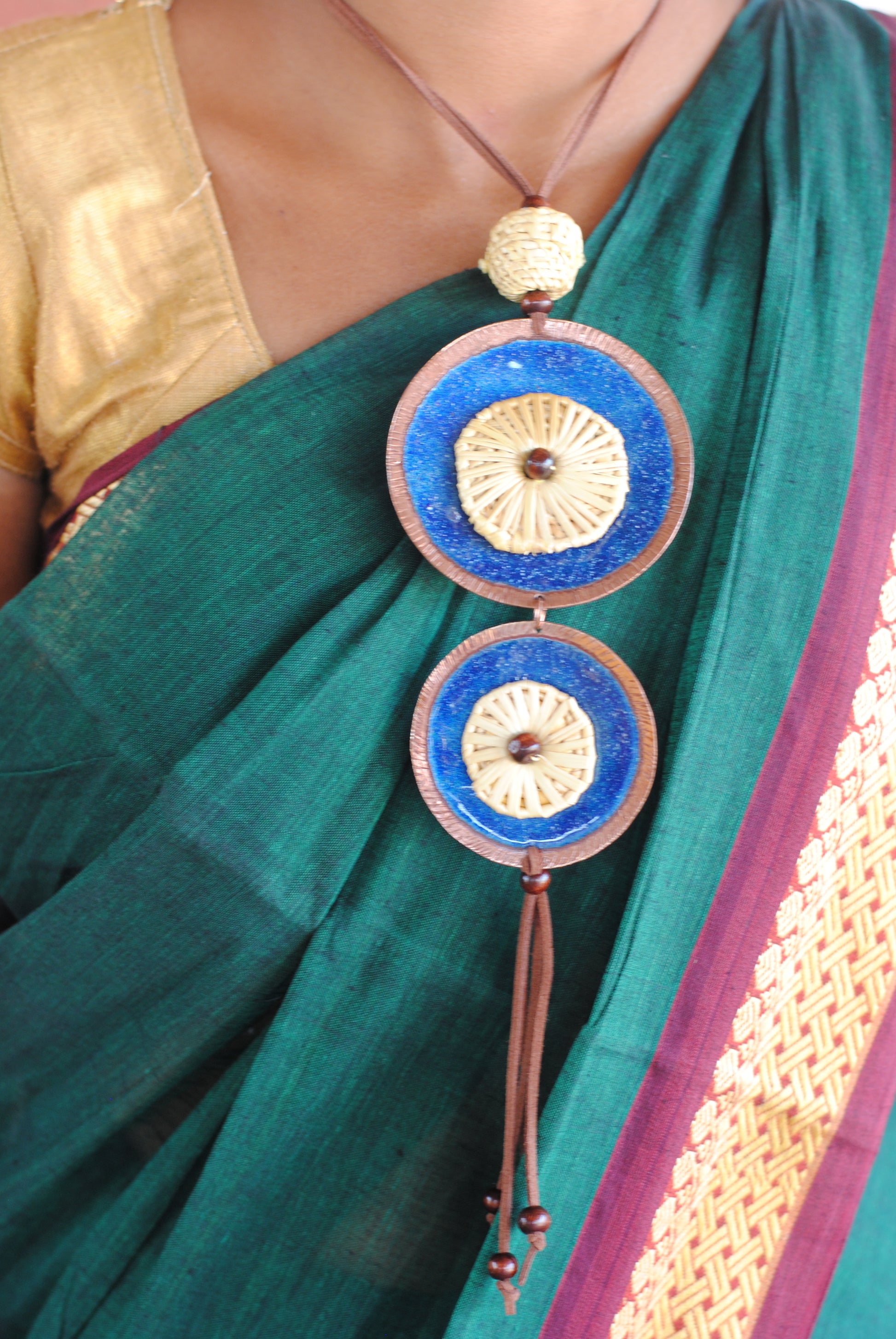 Truna natural fibre golden grass and copper enamel handcrafted jewelry from Odisha, Vaati blue enamel pendant