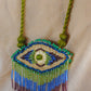 Truna natural fibre golden grass and zardosi handcrafted jewelry from Odisha, nazar blue pendant