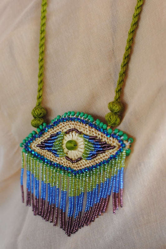 Truna natural fibre golden grass and zardosi handcrafted jewelry from Odisha, nazar blue pendant