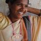 Truna natural fibre golden grass and zardosi handcrafted jewelry from Odisha, nazar pink pendant