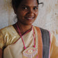 Truna natural fibre golden grass and zardosi handcrafted jewelry from Odisha, nazar pink pendant